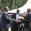 File image of DP Ruto presenting money at a past fundraiser in Kisii