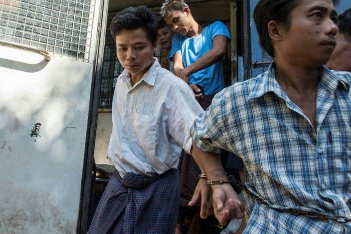 Tun Naing (left) arrives at a Yangon court compound on November 18, 2016