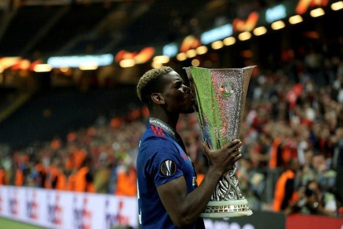 Paul Pogba kisses the Europa League trophy after Manchester United won their final against Ajax Amsterdam on May 24, 2017 at the Friends Arena in Solna outside Stockholm