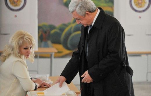 Armenian President Serzh Sarkisian casts his ballot in elections observers say were marred by allegations of fraud
