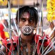 A Malaysian Hindu devotee walks in a trance towards the Batu caves temple during the Thaipusam festival celebrations in Kuala Lumpur
