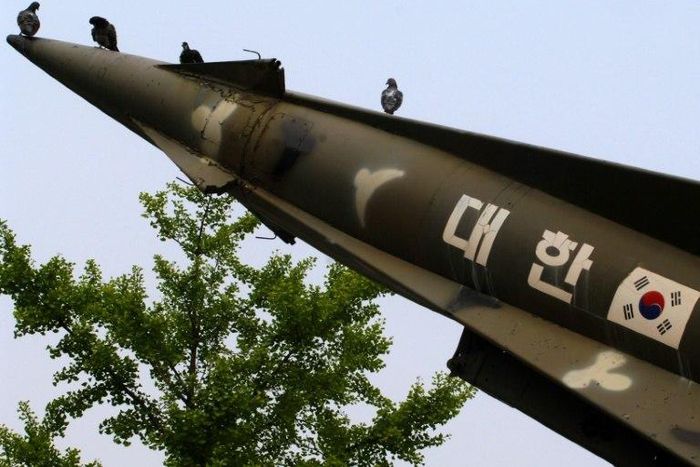 Pigeons sit on a South Korean missile on display at the Korea War Memorial Museum in Seoul