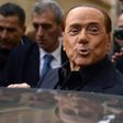Former Italian prime minister Silvio Berlusconi leaves after voting in a referendum on constitutional reforms in Rome on December 4, 2016