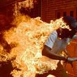 A demonstrator catches fire during clashes with riot police within a protest against Venezuelan President Nicolas Maduro, in Caracas on May 3, 2017