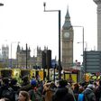 Members of the emergency services work on Westminster Bridge, alongside the Houses of Parliament in central London on March 22, 2017
