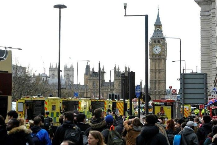 Members of the emergency services work on Westminster Bridge, alongside the Houses of Parliament in central London on March 22, 2017