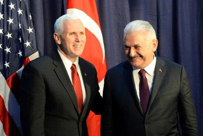 US Vice President Michael Richard Pence (L) and Turkish Prime Minister Binali Yildirim pose for photographers ahead talks at the Munich Security Conference
