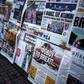 A picture taken on June 25, 2016 in Athens shows the front page of the Greek newspaper "Ta Nea" (C) reading "be afraid of Brexit"