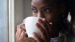 Black woman drinking tea [Stocksy]