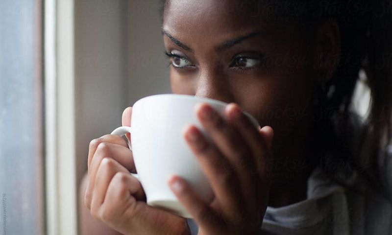 Black woman drinking tea [Stocksy]