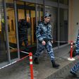 Police officers walk out of an office building, which houses the premises of Kremlin critic Mikhail Khodorkovsky's Open Russia movement, during a police raid, Moscow, April 27, 2017