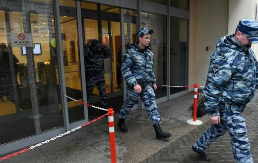 Police officers walk out of an office building, which houses the premises of Kremlin critic Mikhail Khodorkovsky's Open Russia movement, during a police raid, Moscow, April 27, 2017