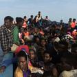 Refugees and migrants wait to be rescued by members of Proactiva Open Arms NGO in the Mediterranean Sea, some 12 nautical miles north of Libya