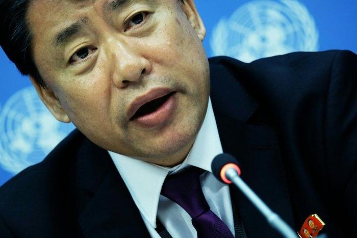 North Korea's deputy UN ambassador Kim In Ryong denies his government is behind cyberattacks while wearing a pin with images of North Korean leader Kim Jong-Un and his late father Kim Kim Jong-il, at the UN headquarters in New York on May 19, 2017.