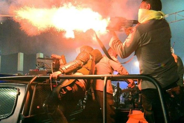 A policeman fires a tear gas canister to disperse Muslim protesters near the presidential palace during clashes after a rally against governor Basuki Tjahaja Purnama, a Christian accused of insulting Islam, in Jakarta, on November 4, 2016