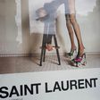 Yves Saint Laurent have been accused of 'degrading' models and 'inciting rape' with a new French advertising campaign. One image (above) shows a model in a leotard and roller skate stilettos bending over a stool