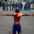 Opposition activists clash with riot police during a protest against President Nicolas Maduro in Caracas on April 26, 2017