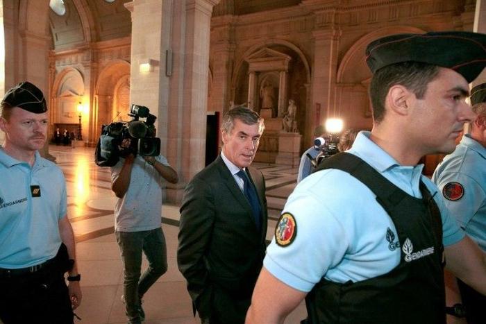 French former budget minister Jerome Cahuzac arrives at the Paris courthouse for his tax fraud trial in September