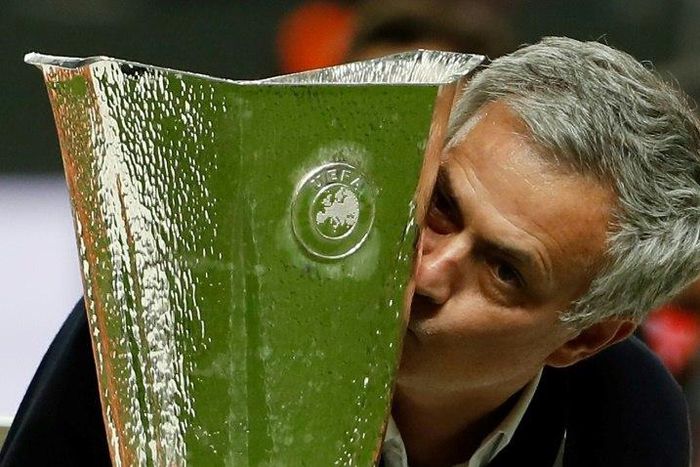 Manchester United manager Jose Mourinho kisses the trophy after his side beat Ajax in Stockholm to win the Europa League on May 24, 2017
