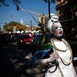 A woman dressed in a wedding gown and holding a South African flag leads a march in Pretoria against the abuse of women following the spike in reports of women being murdered and raped in various parts of the country
