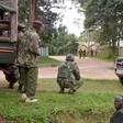 Kenyan police officers hold their position during the deadly shooting at the Kapenguria police station.