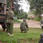 Kenyan police officers hold their position during the deadly shooting at the Kapenguria police station.