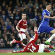 Chelsea's Nemanja Matic (R) skips a tackle by Middlesbrough's Marten de Roon during their English Premier League match, at Stamford Bridge in London, on May 8, 2017