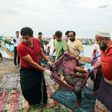 The refugees were hit by light weapons fire in waters off the rebel-held Yemeni port city of Hodeida
