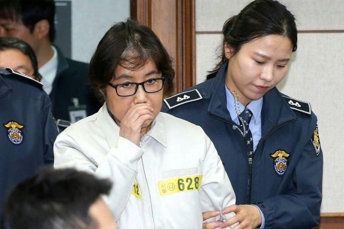 Choi Soon-Sil -- dubbed the "female Rasputin" for the influence she wielded over South Korea's now-impeached president Park Geun-Hye -- is escorted into a Seoul courtroom for her abuse of power trial in 2016