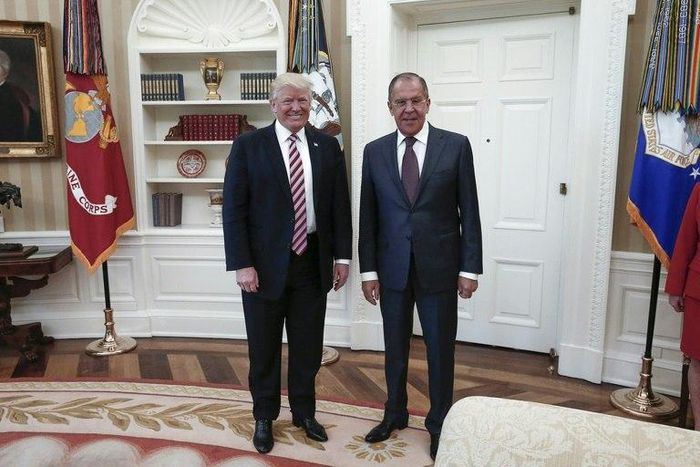 The White House is left fuming after Russia publishes photos of Donald Trump meeting Russian Foreign Minister Sergei Lavrov (R)
