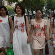 Chen Guiqiu (3rd L), the wife of detained human rights lawyer Xie Yang, is seeking US asylum after fleeing China on foot and brazenly escaping a Thai jail with her two daughters, aided by US officials