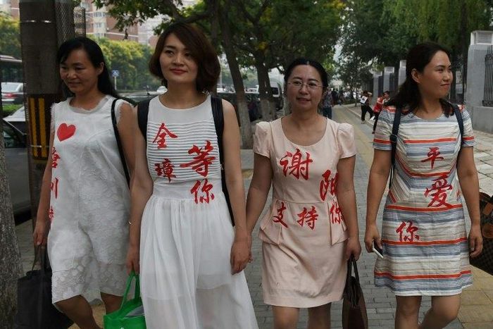 Chen Guiqiu (3rd L), the wife of detained human rights lawyer Xie Yang, is seeking US asylum after fleeing China on foot and brazenly escaping a Thai jail with her two daughters, aided by US officials