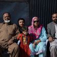 Indian Kashmiri Muhammad Ashraf sees his family for the first time in 26 years, after they were divided by insurgency in disputed Kashmir