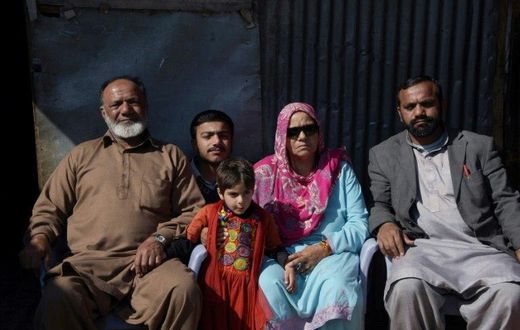 Indian Kashmiri Muhammad Ashraf sees his family for the first time in 26 years, after they were divided by insurgency in disputed Kashmir