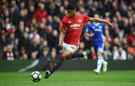 Manchester United's striker Marcus Rashford shoots but misses the target during the English Premier League football match between Manchester United and Chelsea at Old Trafford in Manchester, north west England, on April 16, 2017