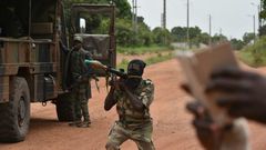 A mutinous soldier holds a RPG rocket launcher inside a military camp in the Ivory Coast's central second city Bouake, on May 15, 2017