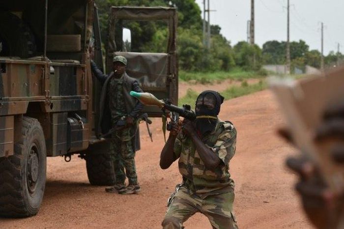 A mutinous soldier holds a RPG rocket launcher inside a military camp in the Ivory Coast's central second city Bouake, on May 15, 2017