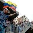 Opposition activists protest against the government in Caracas on May 12, 2017