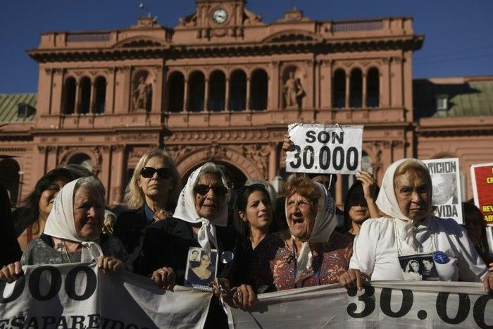 Members of the Argentine human rights group "Madres de Plaza de Mayo" rally in front of the presidential palace in Buenos Aires to mark the 40th anniversary of their first protest demanding answers about kin who went missing during military rule