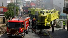 Rescue crews work after a plane crashed into a supermarket warehouse in Tires, near Sintra on April 17, 2017