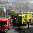 Rescue crews work after a plane crashed into a supermarket warehouse in Tires, near Sintra on April 17, 2017