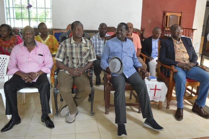Raila Odinga with Muhoho Kenyatta and Raphael Tuju during a memorial service for Jaramogi Oginga and Fidel Odinga in Bondo