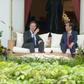 Netherland's Prime Minister Mark Rutte chats to to Indonesian President Joko Widodo at the presidential palace in Jakarta on November 23, 2016