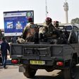 Presidential military personnel patrol Bouake, Ivoy Coast in January after soldiers mutinied demanding extra payment