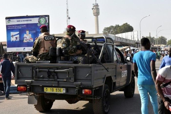 Presidential military personnel patrol Bouake, Ivoy Coast in January after soldiers mutinied demanding extra payment