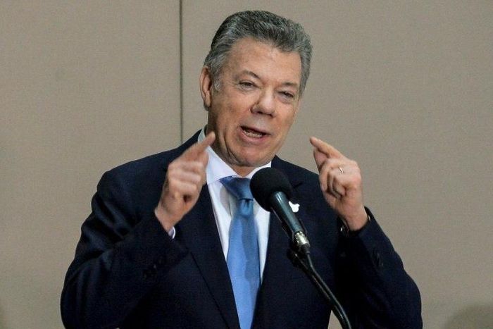"Today we are signing the legal decrees" to set up the Truth Clarification Commission and the Special Unit for Seeking People Reported Missing, Colombian President Juan Manuel Santos said