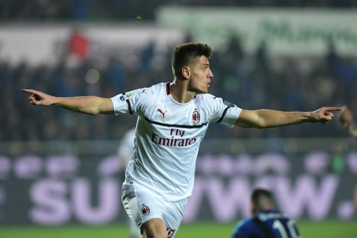 Class act: AC Milan's Krzysztof Piatek celebrates scoring on Saturday