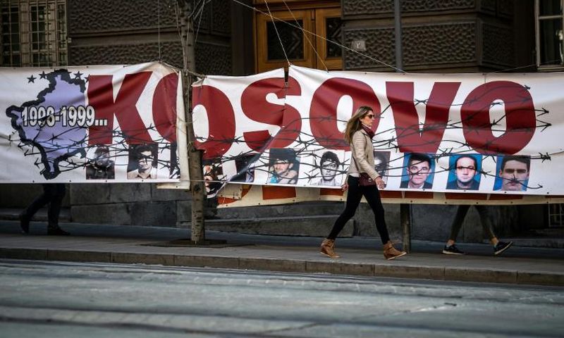 A banner commemorates the anniversary in Belgrade
