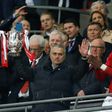 Manchester United's manager Jose Mourinho holds up the trophy as Manchester United players celebrate their victory after the English League Cup final football match between Manchester United and Southampton at Wembley stadium on February 26, 2017