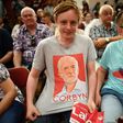 A young Labour Party supporter shows off his T-shirt with the face of Jeremy Corbyn at an election rally in Basildon